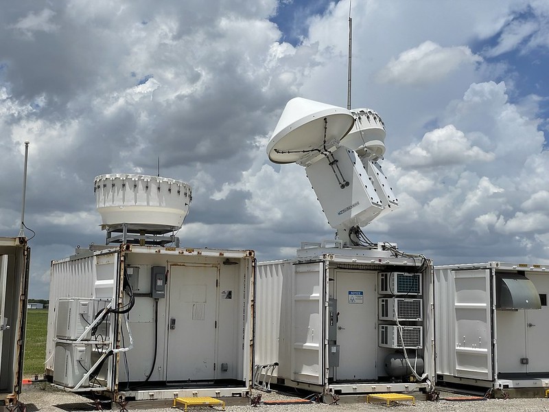 Radars operate in front of a cloud-filled backdrop.