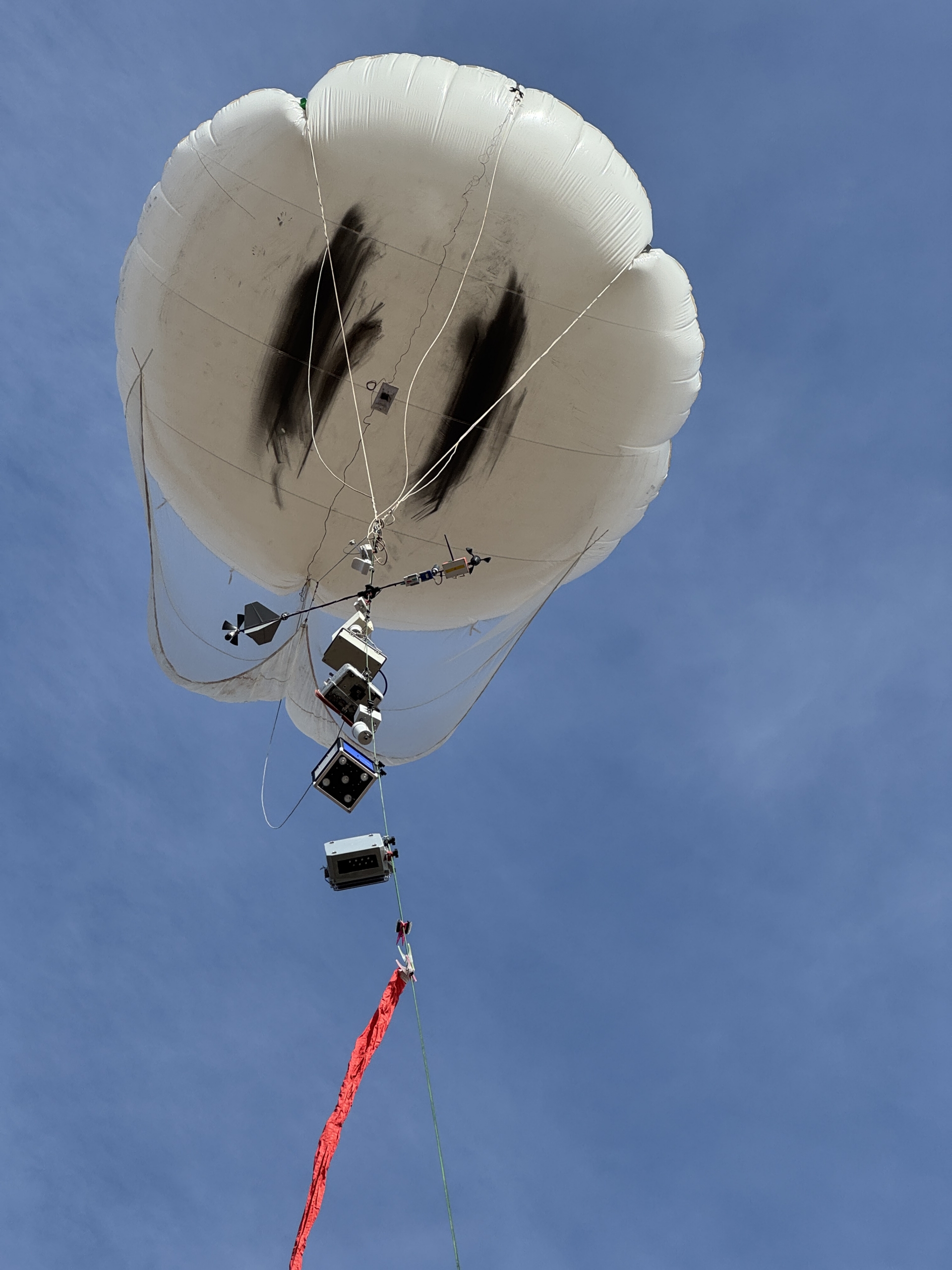 An ARM tethered balloon system (TBS) rises above the CoURAGE site in the Baltimore area.