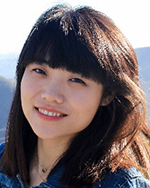 Dié Wang poses outside for a picture.