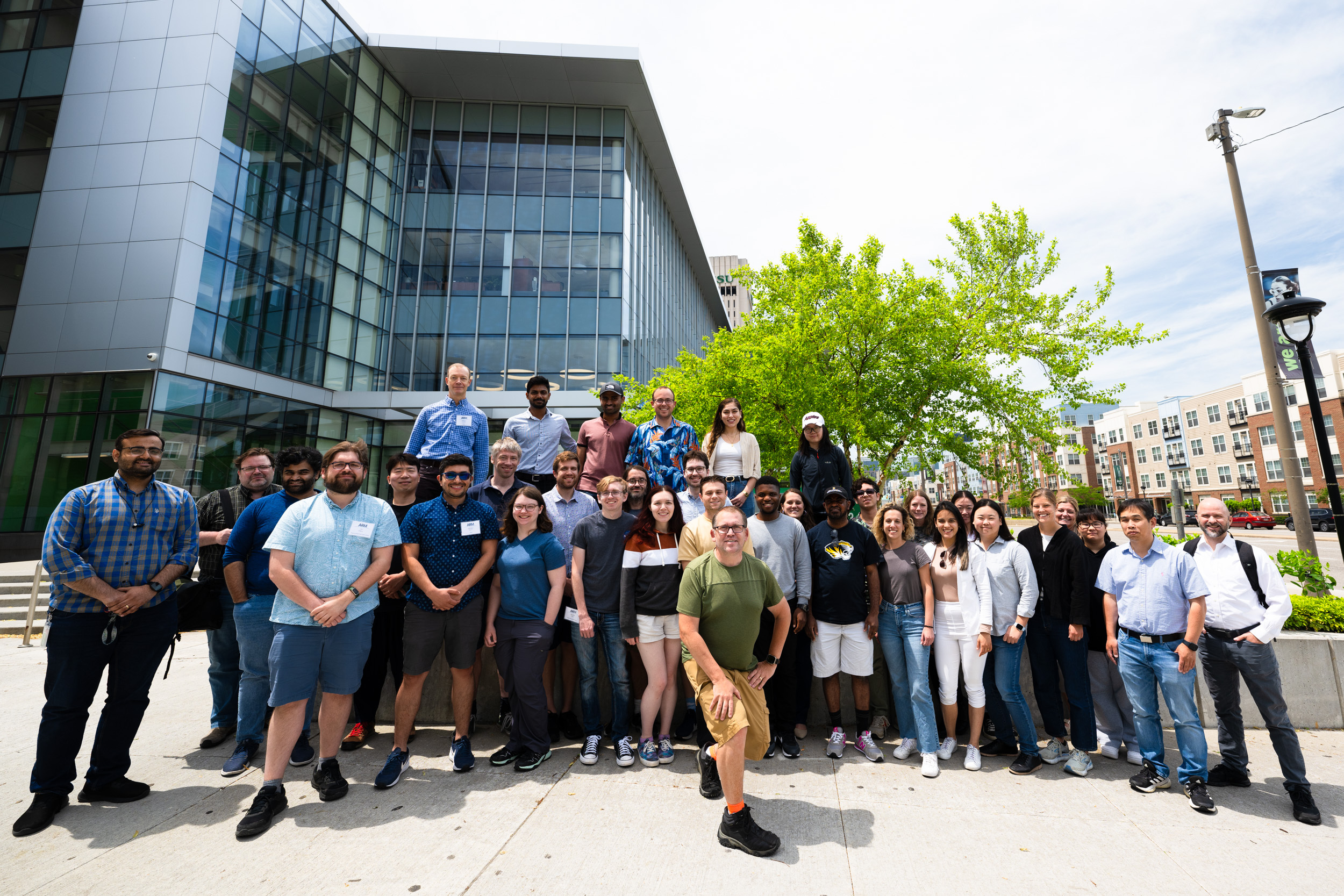 A group stands in front of a building at Cleveland State University.