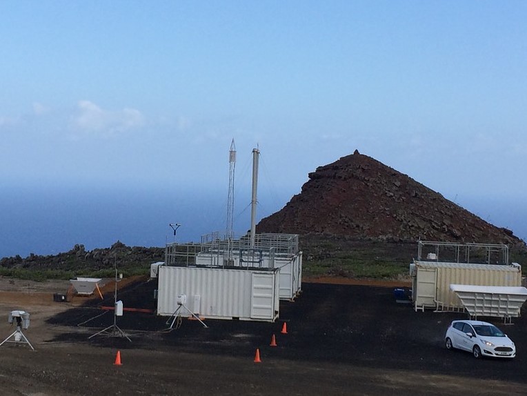 ARM instruments and containers are located on land overlooking the Atlantic Ocean.