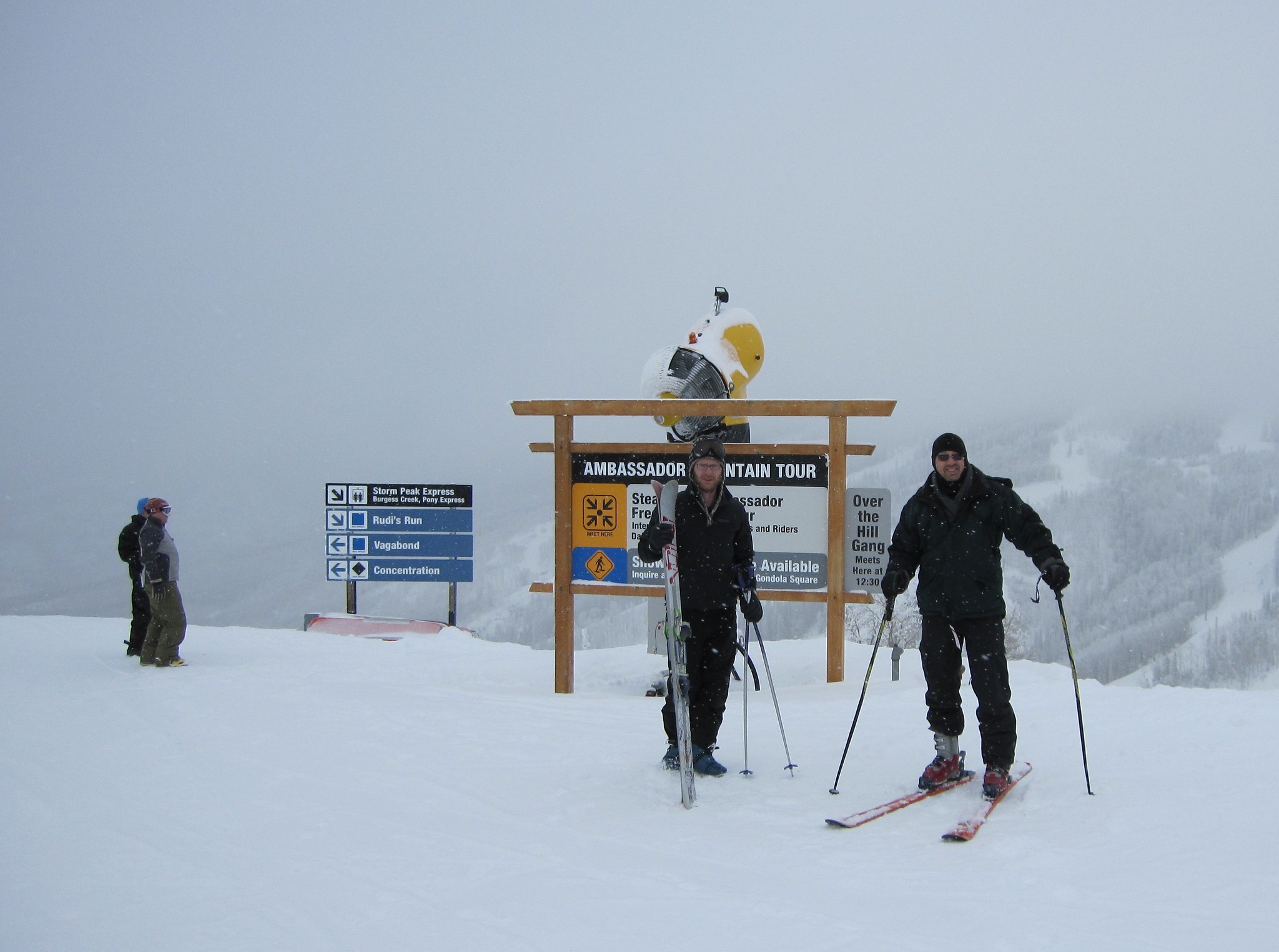 Jay Mace (right) and Matthew Shupe prepare to head out on skis and tour the observation sites for ARM’s 2010─2011 Storm Peak Lab Cloud Property Validation Experiment (STORMVEX) in Steamboat Springs, Colorado. Mace was STORMVEX’s principal investigator, and Shupe was also on the campaign’s science team. A sign nearby points out the direction of Storm Peak Express, Rudi's Run, Vagabond, and Concentration. ARM file photo.